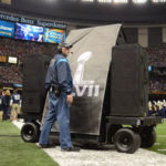 An image of speakers getting rolled on/off the field at the Super Bowl. Image by Patrick Baltzell.